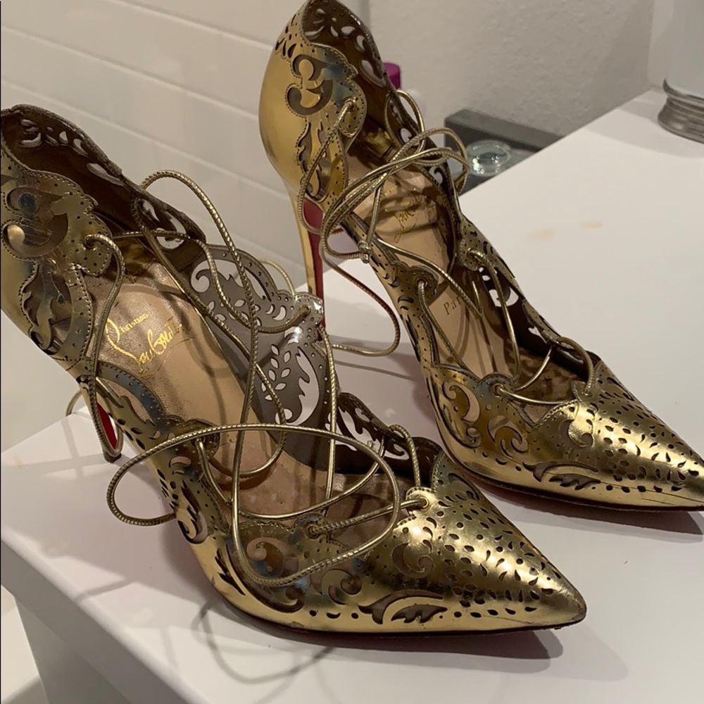 Gold Christian louboutins impera